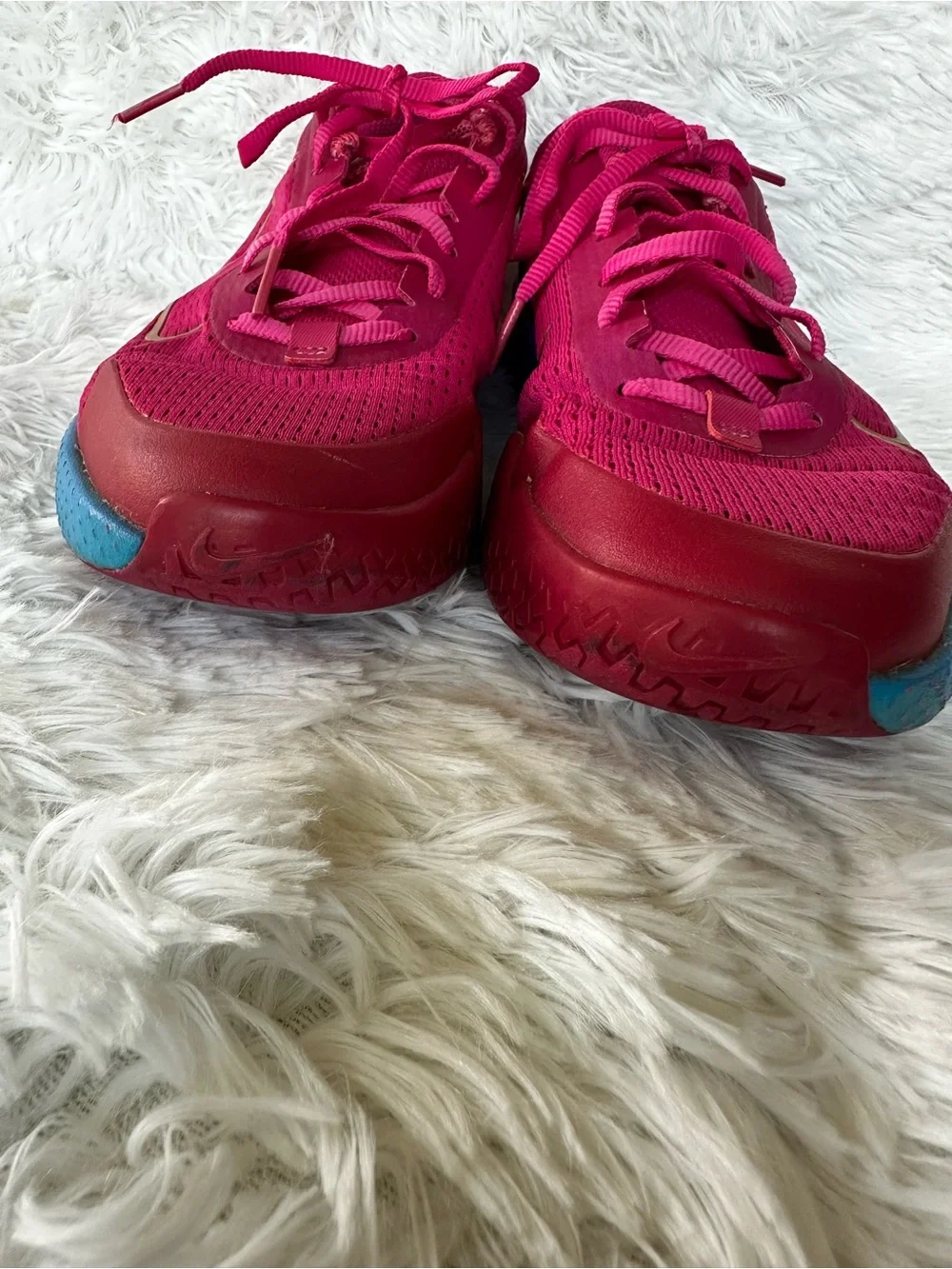 Nike Women's Bold Pink Athletic Court Shoes with Teal Purple Gradient Accent.